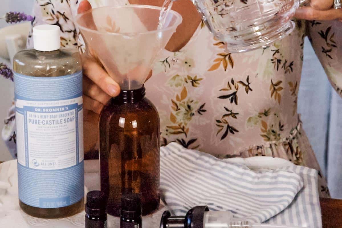 Image of water being poured into the dispenser through a funnel