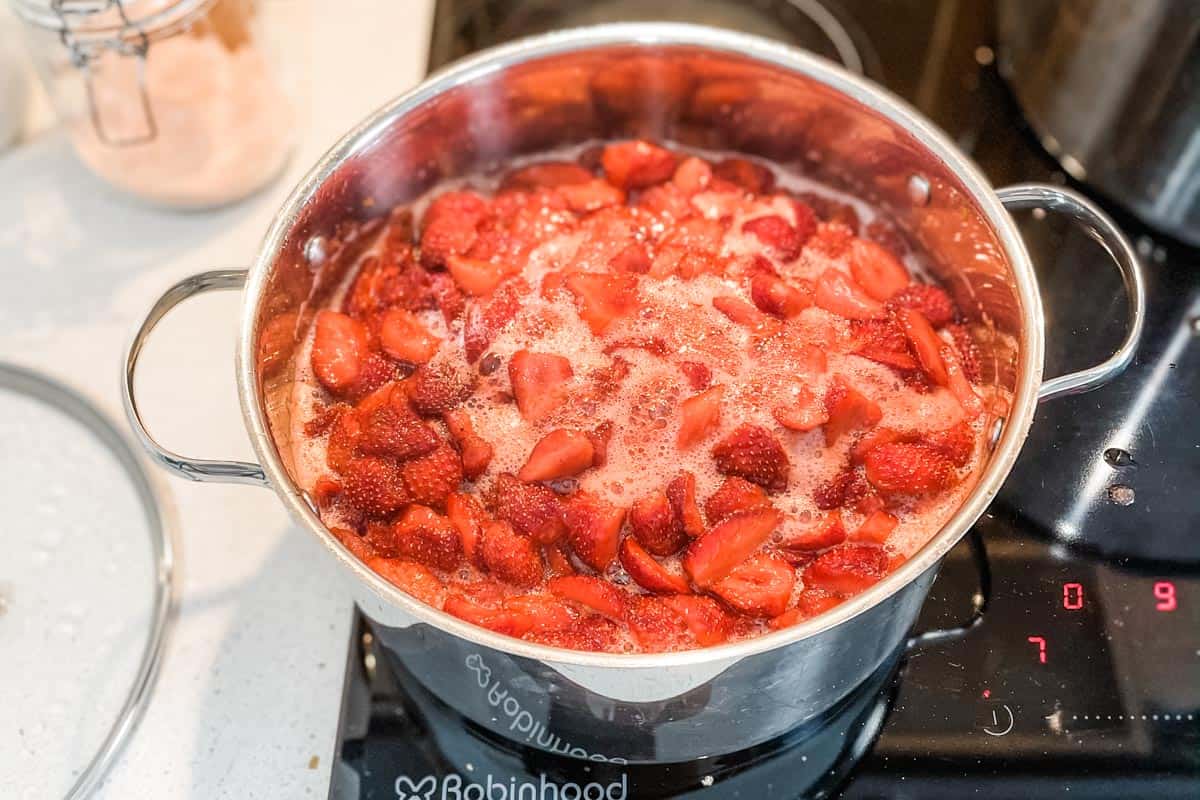 Pot of strawberry jam boiling