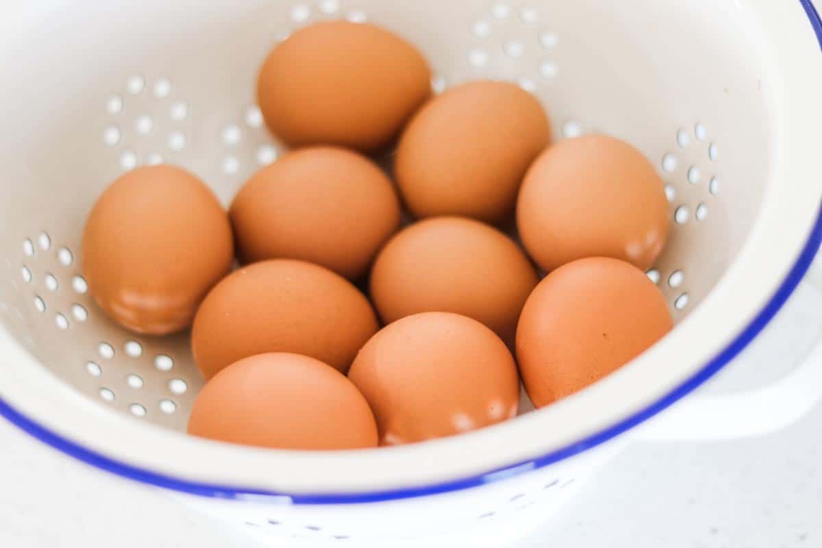 Image of eggs in a white enamel colander