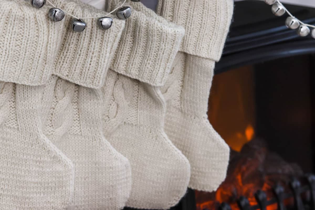 Four handmade cable knit cottage style Christmas stockings