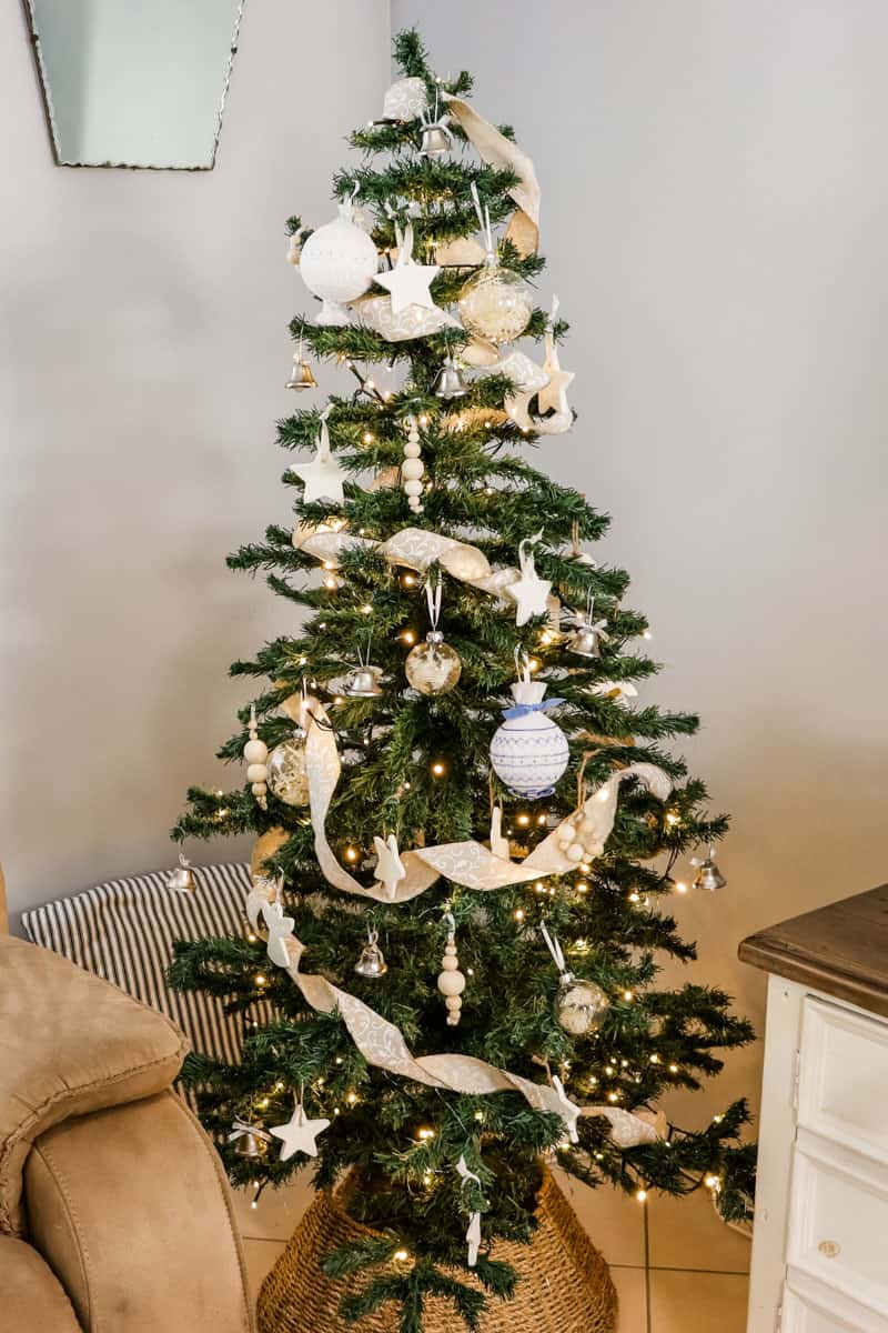 Cottage style Christmas tree adorned with handmade ornaments and linen look ribbon