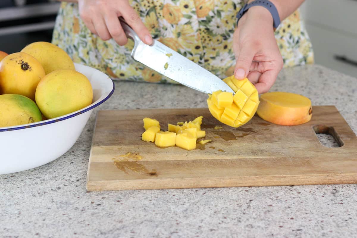 Mango is being chopped for the mango chutney canning recipe