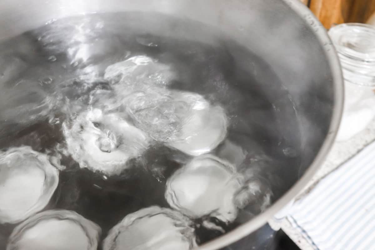 Water boiling during processing canning of the mango chutney in the water bath