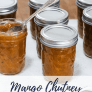 graphic with a photo of jars of mango chutney on a white tray and text 'mango chutney canning recipe'