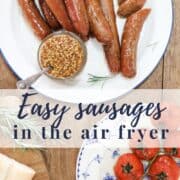 A graphic with cooked sausages served on a plate with a jar of mustard next to a plate of cooked tomatoes and text 'easy sausages in the air fryer'