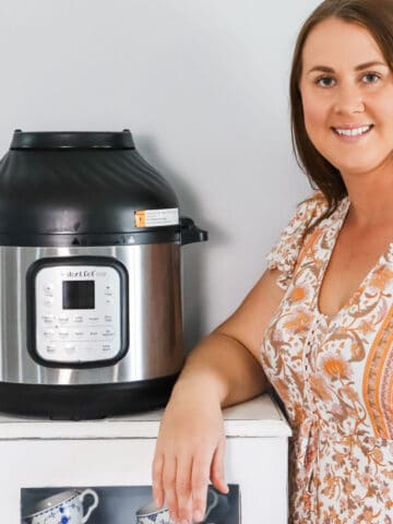 Emily standing next to an instant pot air fryer