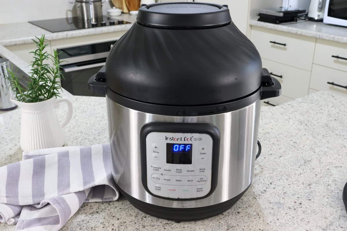The healthy non toxic air fryer sits on the kitchen bench