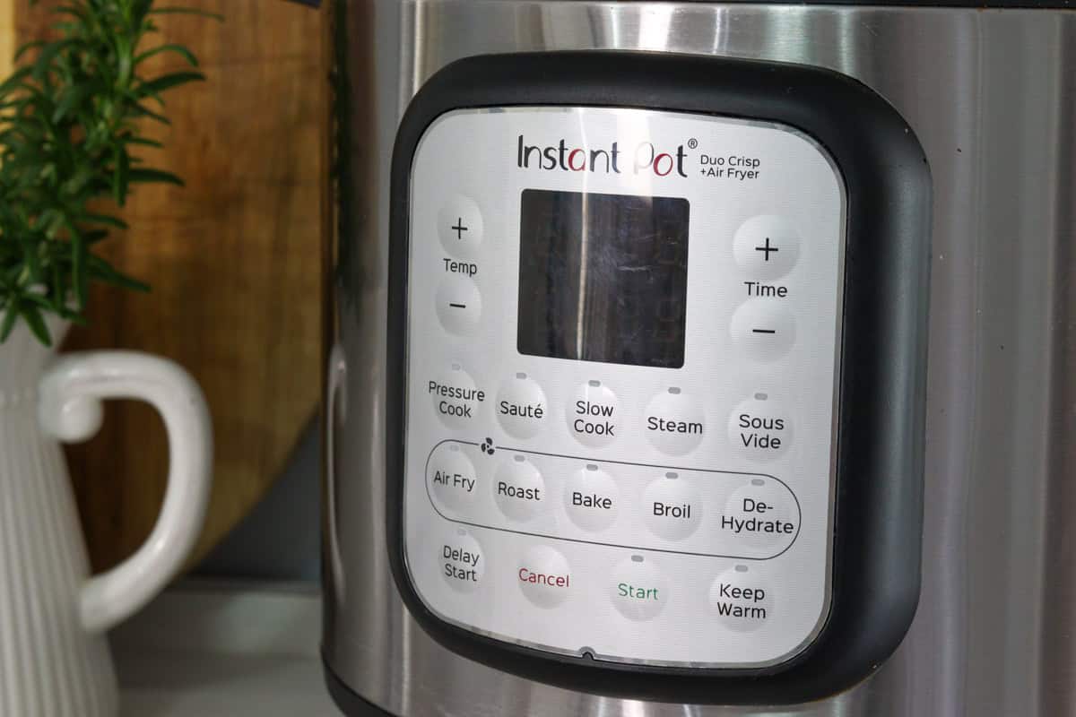 The control panel on the air fryer shows the variety of cooking modes that can be selected