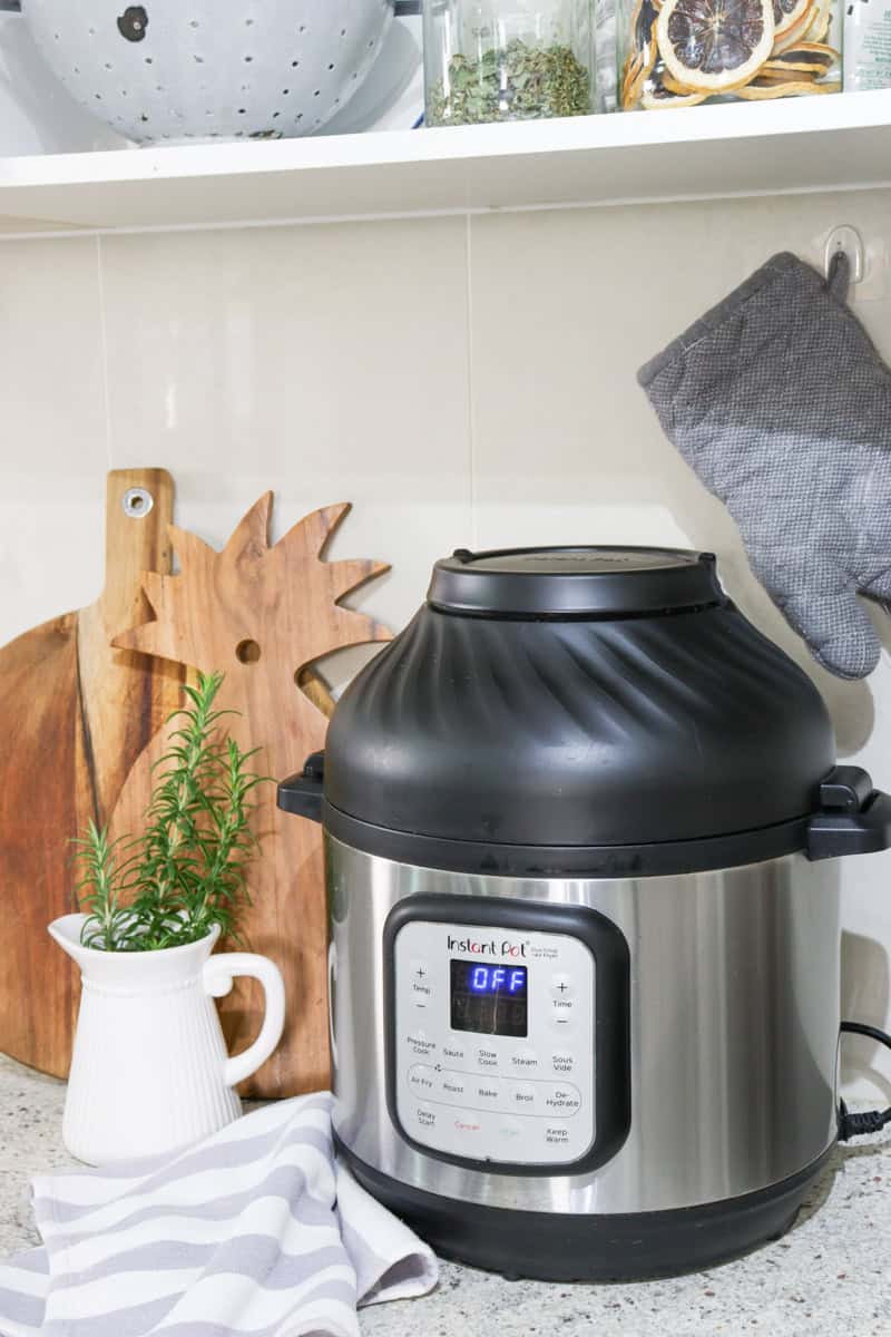 The healthy non toxic air fryer sits on the kitchen bench