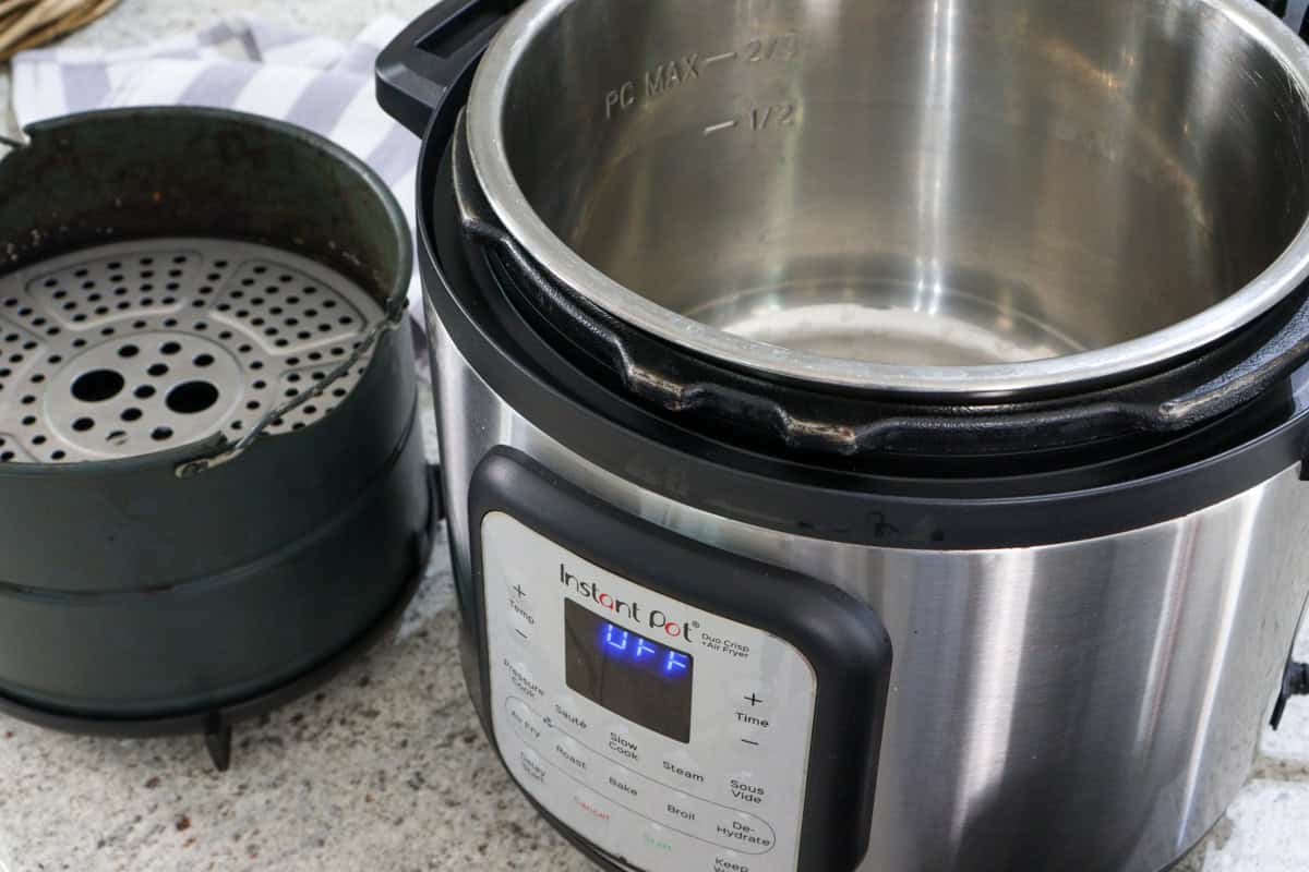 The inside view of the healthy non toxic instant pot air fryer shows stainless steel and ceramic parts