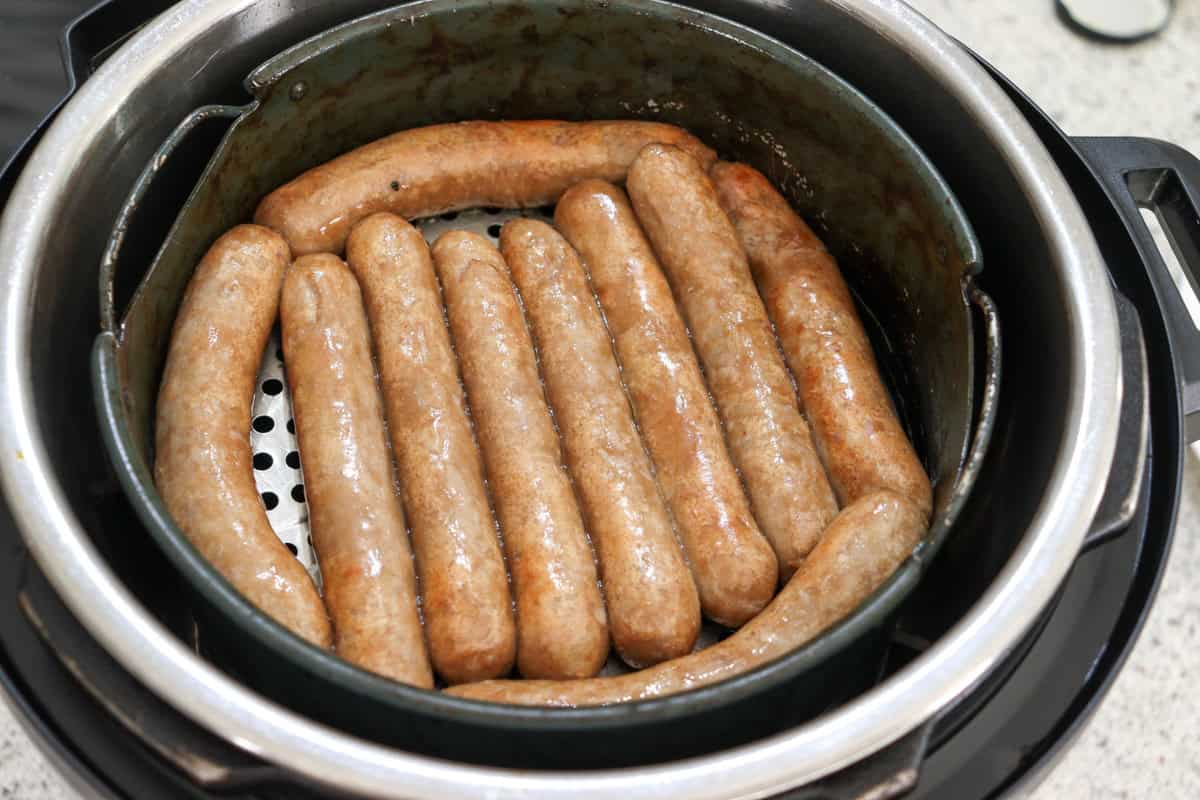 Cooked sausages in the air fryer basket