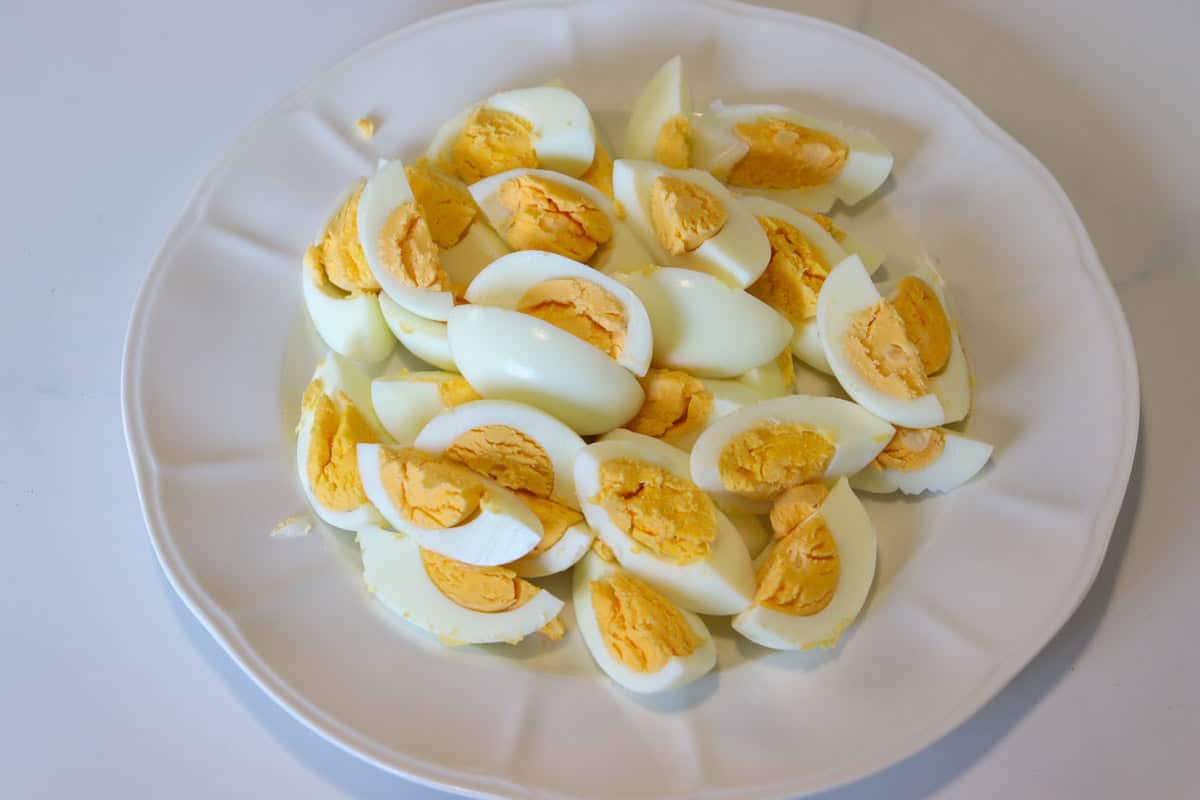 Sliced, boiled eggs on a plate