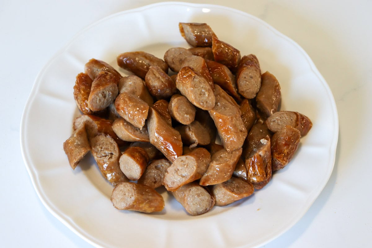 Cooked and sliced sausages