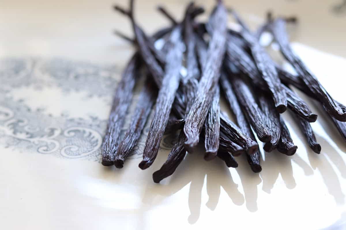 A close up image of the dried vanilla beans on a platter