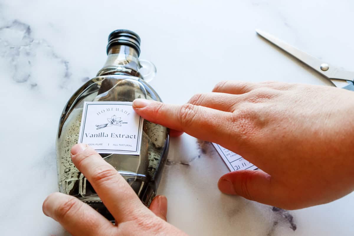 The labels are attached with glue to the front of the bottle