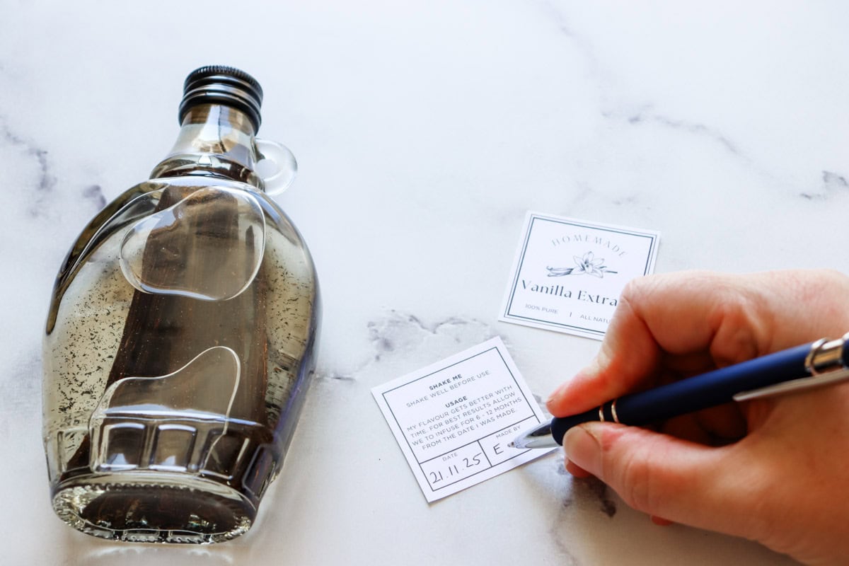 A pen is used to write the date made and the name of the maker on the labels