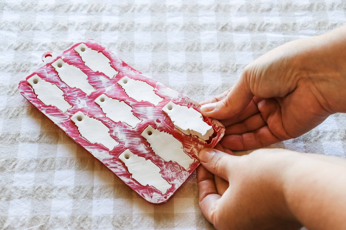 Semi-dry ornaments being removed from the mould
