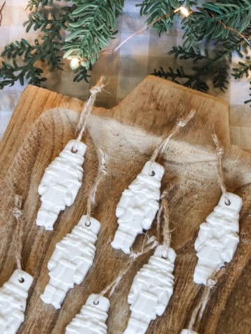 air dry clay Christmas tree ornaments on a wooden tray