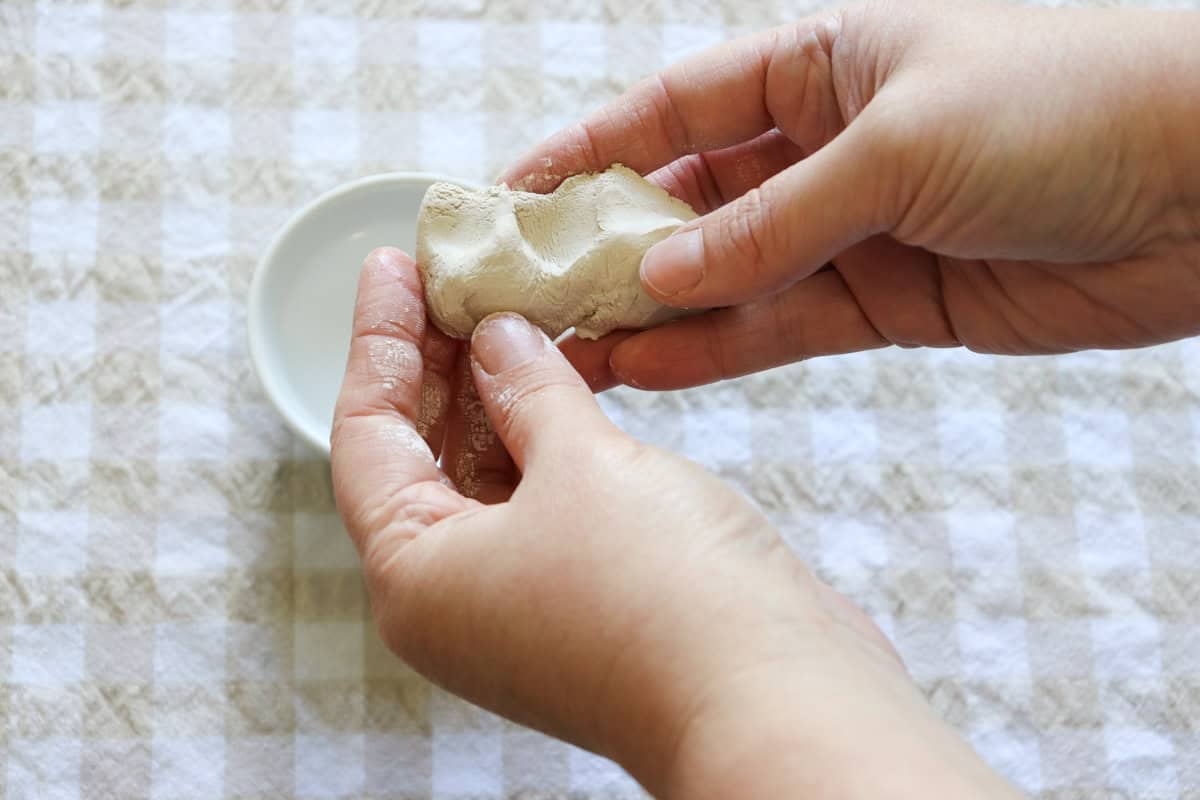 Air dry clay being massaged by hand