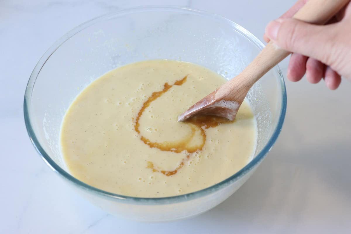The vanilla extract is added to the custard
