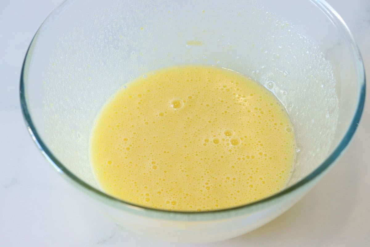Eggs, egg yolks and sugar has been whisked together and has become pale