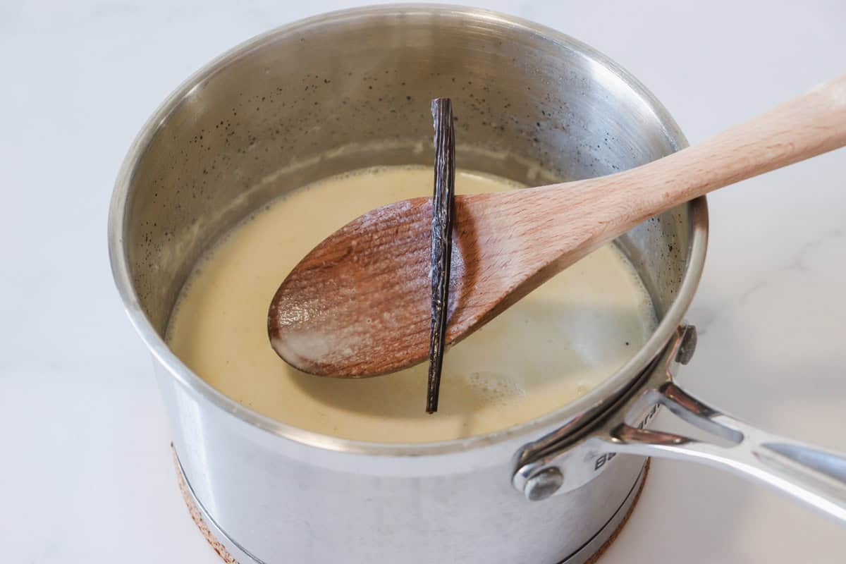 The vanilla bean is removed from the milk and cream mixture