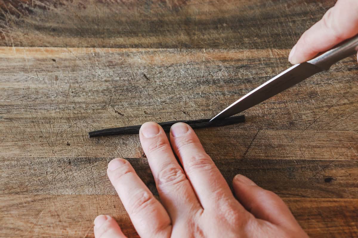 The vanilla bean is split with a paring knife