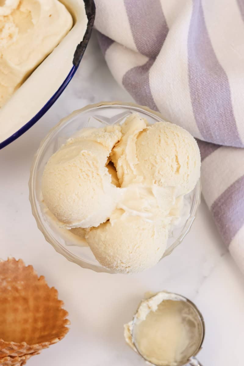 The ice cream is scooped and served in a dessert bowl