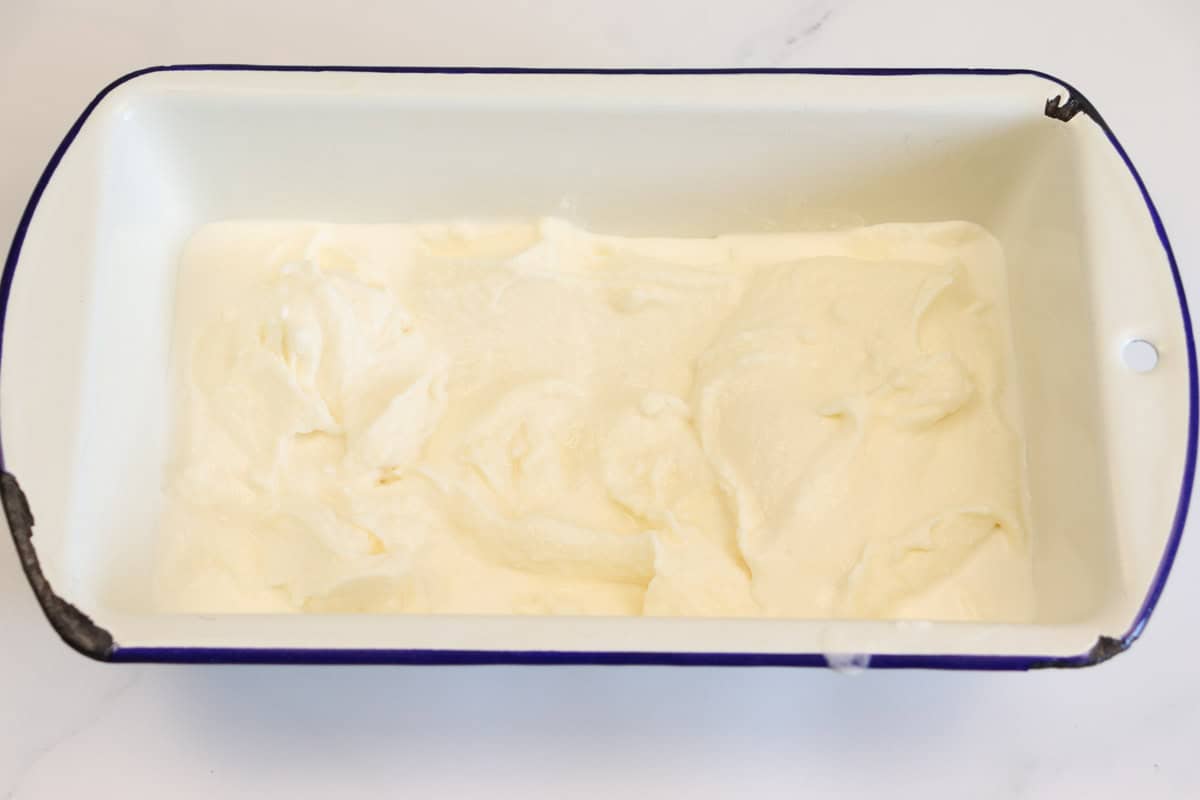 After churning half of the ice cream is added to a container