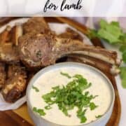 Graphic for Pinterest with text "Mint and Yogurt Sauce for lamb" and an image of a bowl of sauce served on a platter next to lamb cutlets